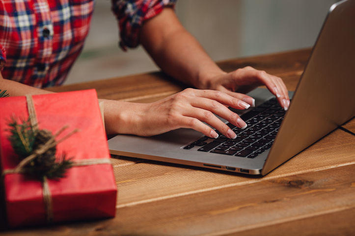 closeup woman hands working with laptop